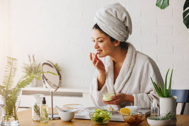 istock Young woman cleaning face with natural cosmetics 1221475298