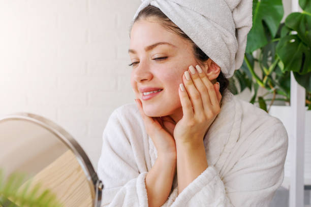 istock Young woman cleaning face with natural cosmetics 1221476186