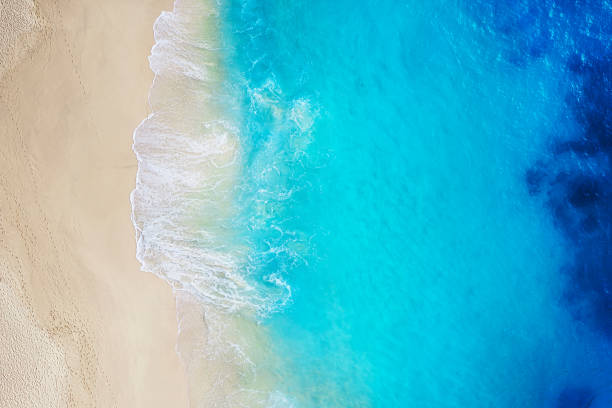 istock Coast as a background from top view. Turquoise water background from top view. Summer seascape from air. Nusa Penida island, Indonesia. Travel - image 1221477042
