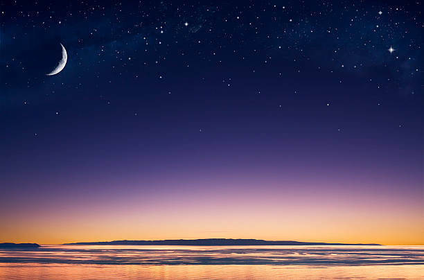 Island Moon A crescent moon and stars over an island in the Pacific ocean just after sunset. star sky night island stock pictures, royalty-free photos & images