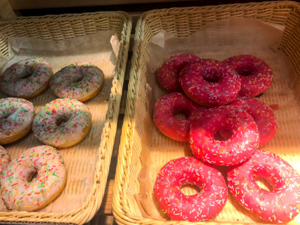 istock Boxes with donuts on shelves of bread shop, Hanukkah celebration 1221477995