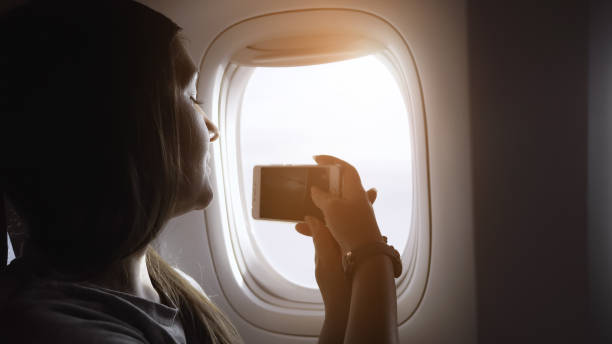 istock girl makes video on phone outside passenger cabin closeup 1221479607