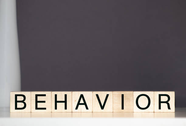 istock BEHAVIOR word written on wood block. BEHAVIOR text on wooden table for your desing, concept. 1221479712
