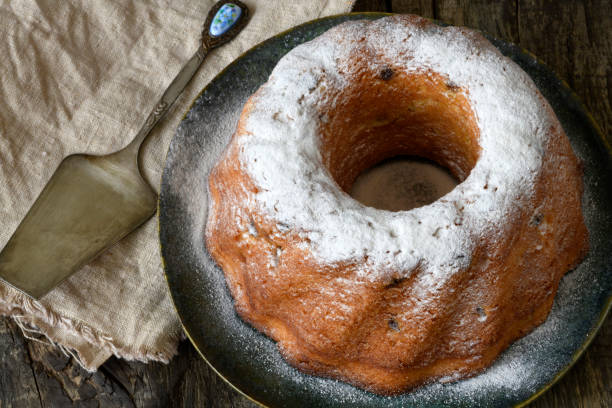 istock Round bundt cake sprinkled with powdered sugar, close-up. 1221479929