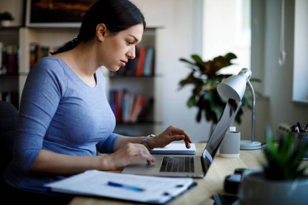 istock Young woman working from home 1221479973