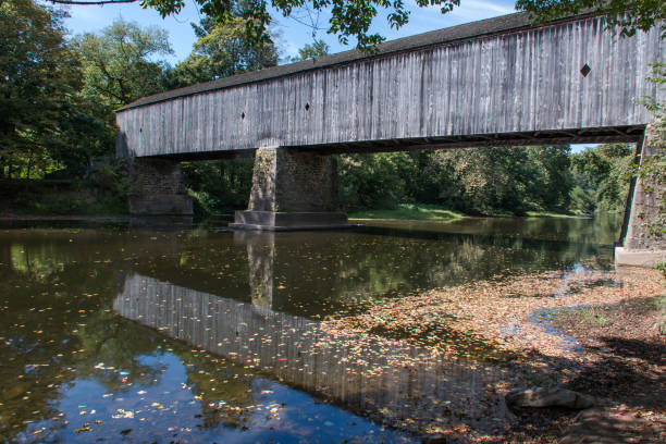 istock Old covered bridge on a creek in Pennsylvania 1221480996