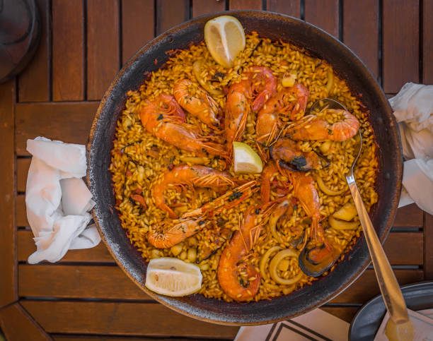 istock Paella at seaside in Spain 1221481217