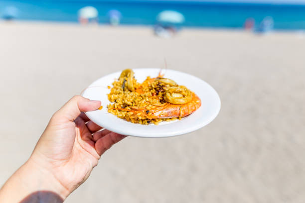 istock Paella at seaside in Spain 1221481499