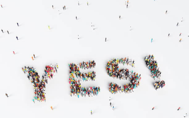 istock Big group of people forming YES inscription 1221482609
