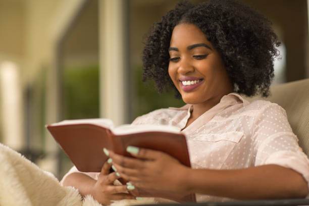 istock Happy woman reading. 1221483412