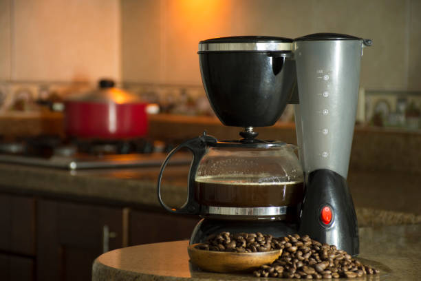 istock Electric coffee maker and coffee beans in the kitchen. 1221484029