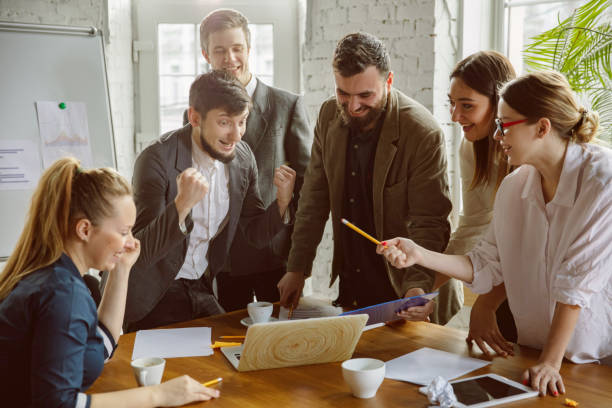 istock Group of young business professionals having a meeting, creative office 1221488826