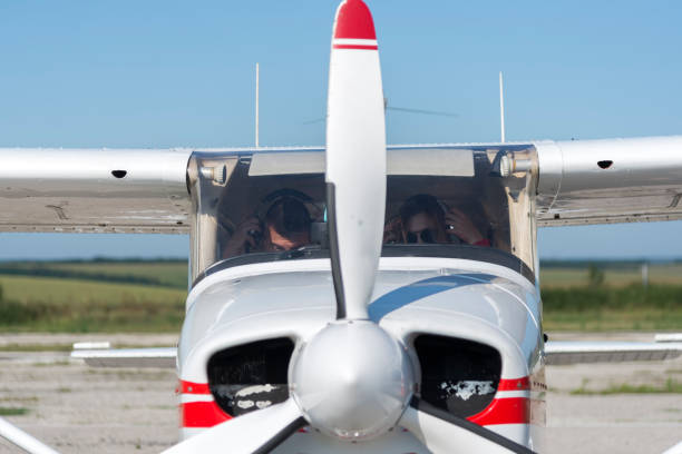 istock Female pilot of a light aircraft posing for photos. 1221491969