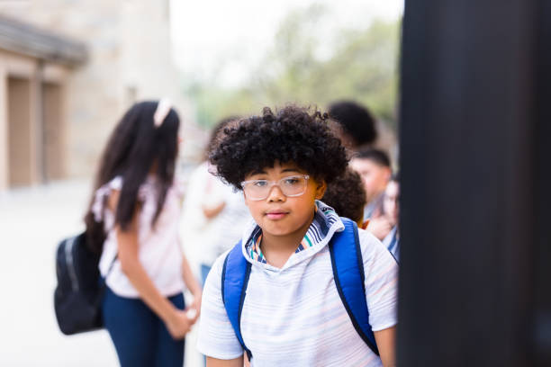 istock School boy prepares to board school bus 1221491996