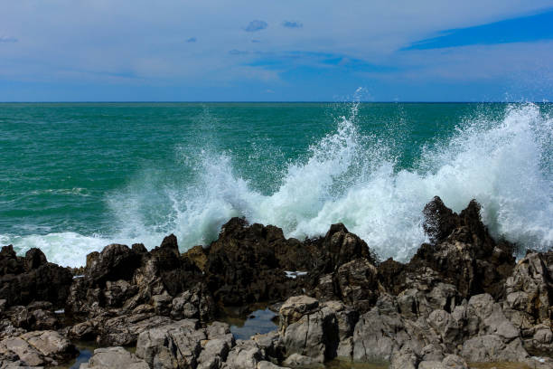 istock Sea waves crash and splash on rocks. 1221495771