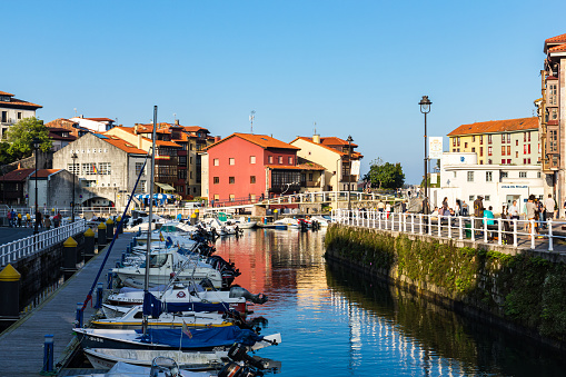 Asturias, SPAIN - September 11, 2018: A general view of LLanes with boats taken in summer at sunset , Asturias, Spain