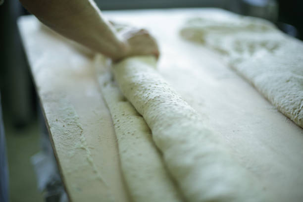 Kneading breadstick dough in Italy in Italy, Piedmont, Roddino