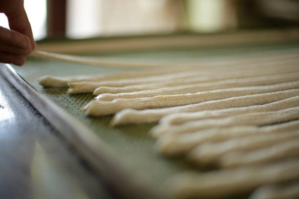 Making breadsticks by hand in Italy