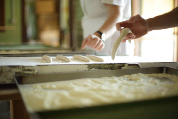 istock Making organic breadsticks by hand in Italy 1221497497