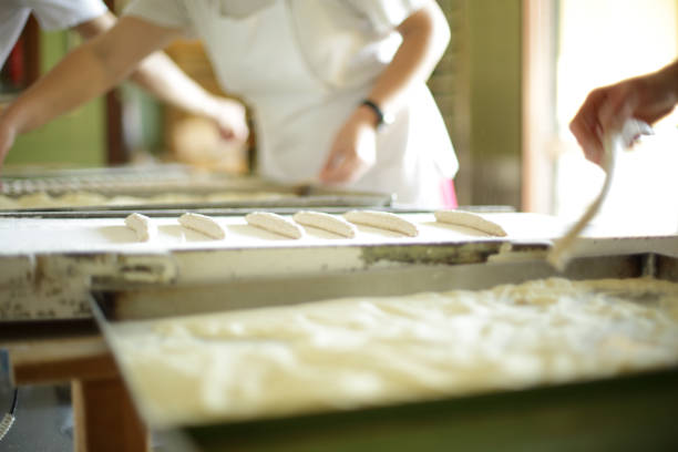 istock Making organic breadsticks by hand in Italy 1221497498