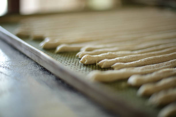 Organic handmade breadsticks waiting to be baked in Italy