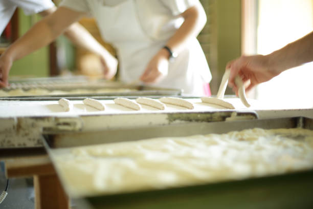 istock Making organic artisanal breadsticks by hand in Italy 1221497502