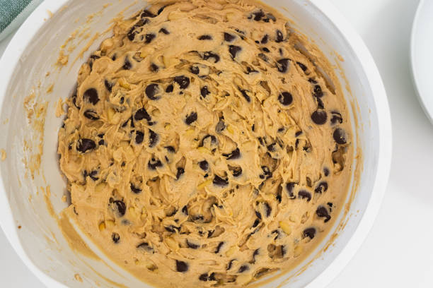 istock Cake batter Chocolate Chip Cookies close up in a bowl. Baking old-fashioned chocolate chip cookies 1221497822
