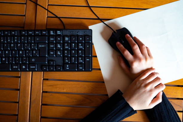 istock Woman with wrist pain from working with the mouse. 1221497896
