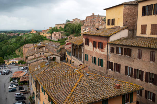 Siena, Italy - May 14, 2018. Old houses in Siena, a medieval city in Tuscany region of Central Italy.