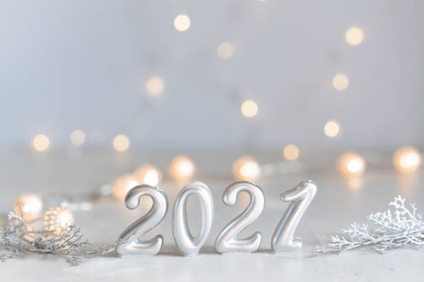 istock New Year 2021 silver balloons with fireworks 1221500907