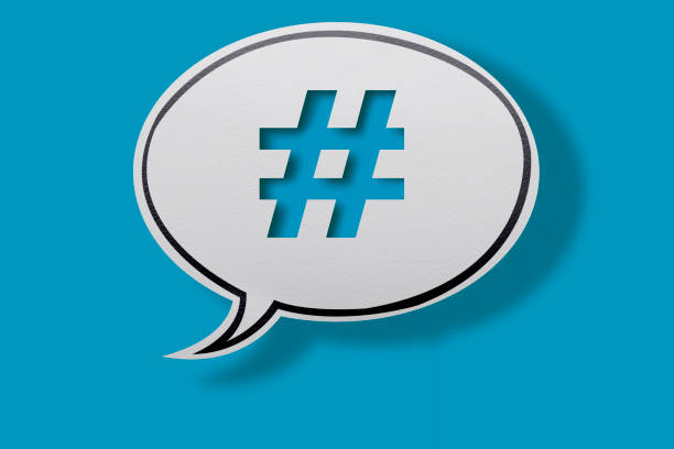 istock White, Rounded Chat Bubble With Hashtag Symbol On Blue Background with clipping path. 1221505961