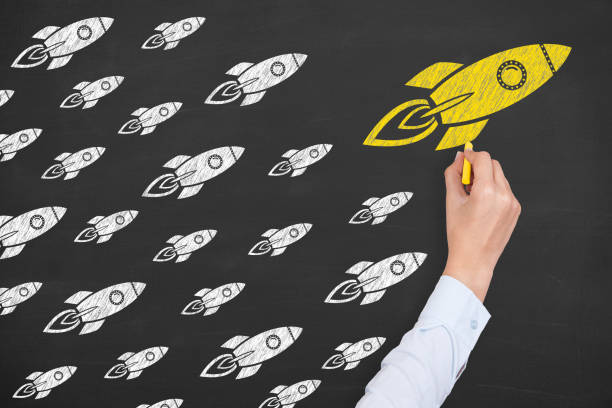 istock Leadership Concepts with Rockets on Chalkboard Background 1221507883