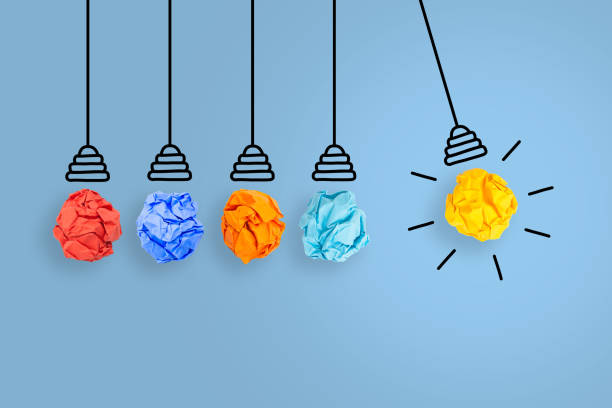 istock New Idea Concepts with Light Bulb Crumpled Paper on Blue Background 1221508086