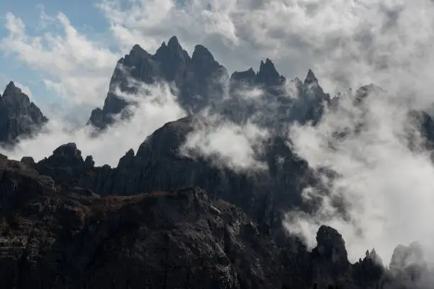 Mountain peaks covered with clouds at Tre cime area in Italy