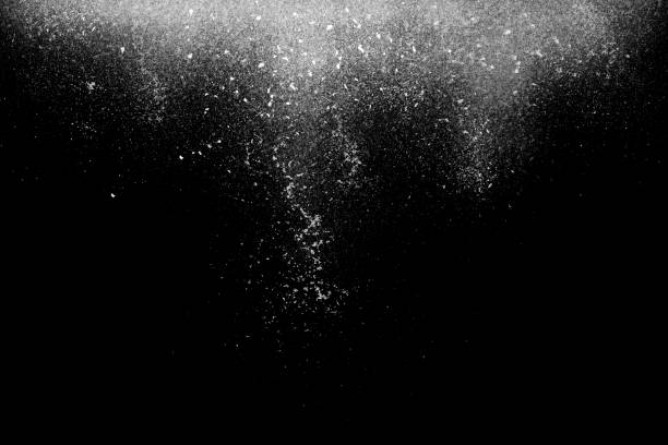 Freeze motion of white powder falling on black Freeze motion of white star powder falling, isolated on black, dark background. Abstract design of white dust cloud. Particles explosion screen saver, wallpaper with copyspace. Planet creation concept photoshop texture stock pictures, royalty-free photos & images