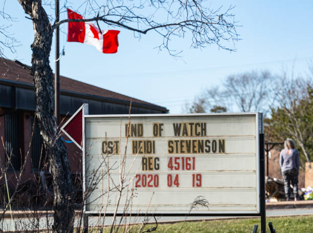 End of Watch - Heidi Stevenson April 25, 2020 - Elmsdale, Canada - End of Watch memorial sign for Heidi Stevenson who was stationed at the Elmsdale Detachment of the RCMP & killed while trying to stop a wanted gunman who killed 22 people in Canada's worst mass shooting to date. police station canada stock pictures, royalty-free photos & images