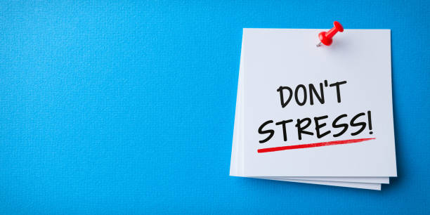 istock White Sticky Note With Don't Stress And Red Push Pin On Blue Background 1221515197