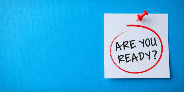 istock White Sticky Note With Are You Ready And Red Push Pin On Blue Background 1221515707