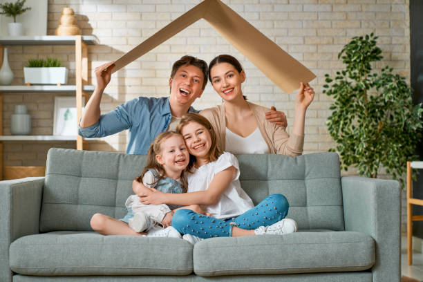 istock Two children with mother and father. 1221516258