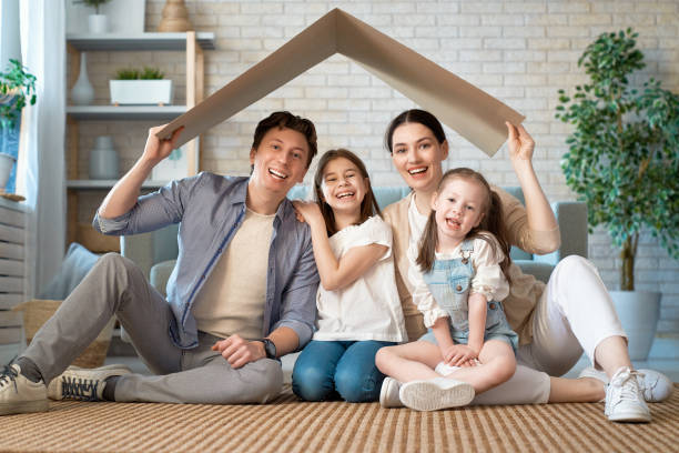 istock Two children with mother and father. 1221516263
