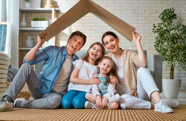 istock Two children with mother and father. 1221516307
