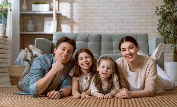 istock Two children with mother and father. 1221516315
