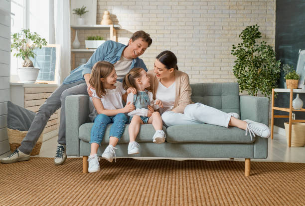 istock Two children with mother and father. 1221516321