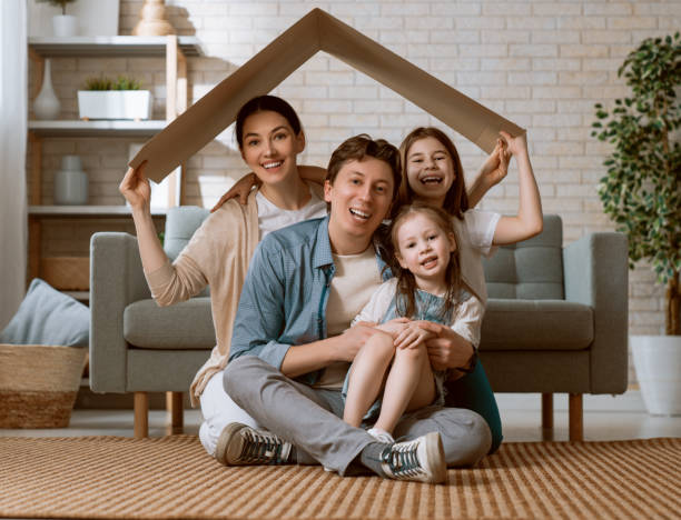 istock Two children with mother and father. 1221516335