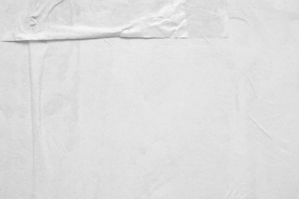 istock Blank white crumpled and creased paper poster texture background 1221516548
