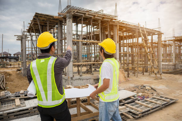 istock Asian business man construction engineer workers at house building site 1221516589