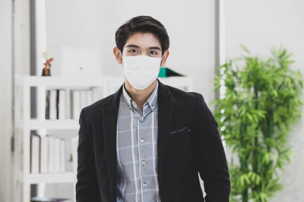 istock Businessman wearing surgical mask. 1221519248