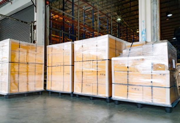 istock Interior of warehouse with stack package boxes on pallets, Warehouse industry delivery shipment goods, Logistics and transport 1221519390