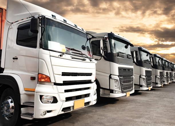 istock Trucks on parking lined up, Road freight industry cargo shipping service, Logistics and transport 1221519441