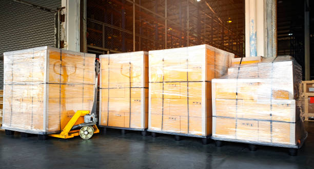 istock Interior of storage warehouse, large shipment package boxes on pallets, Warehouse industry delivery shipment goods, Logistics and transport 1221519596